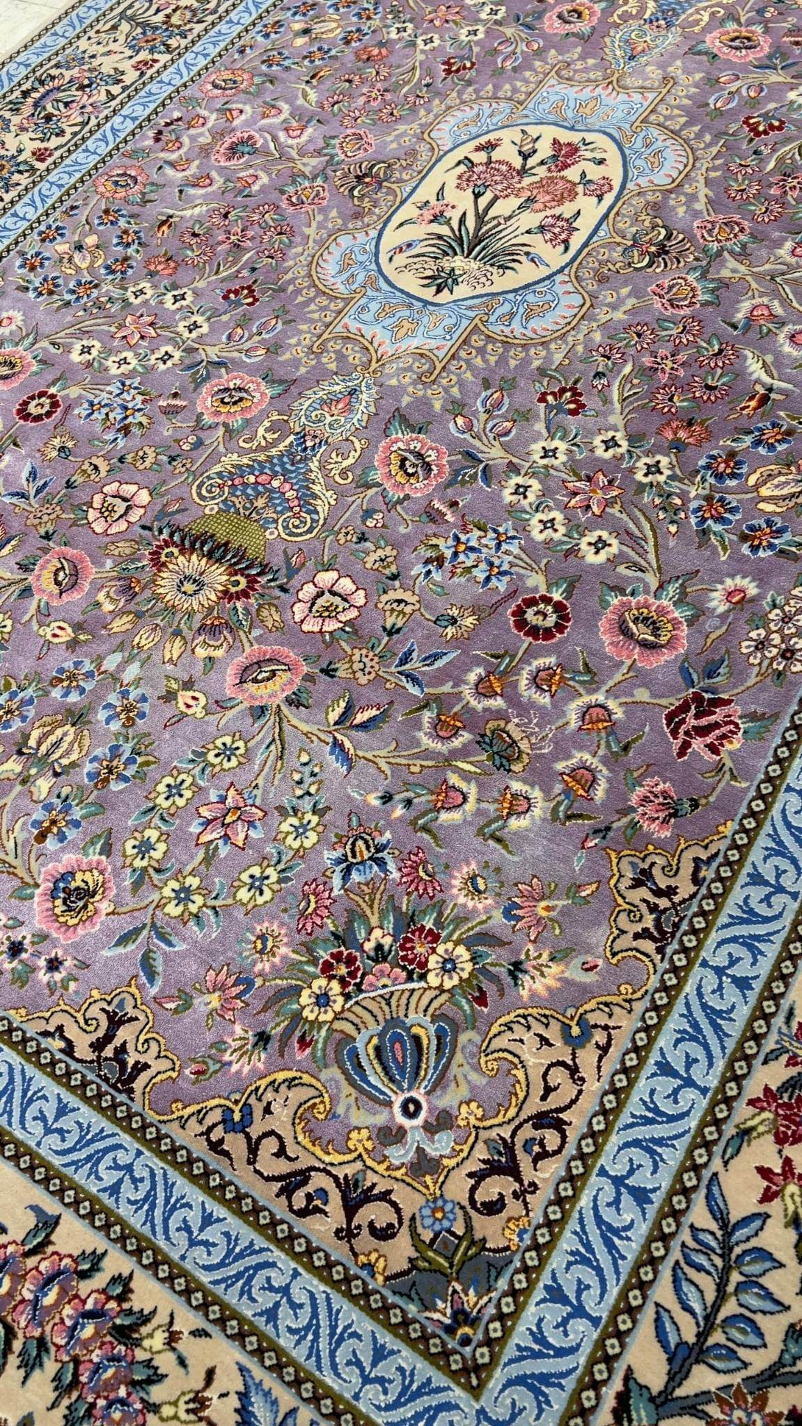 "Luxurious wool and silk Persian rug with exquisite floral details, perfect for sophisticated interiors."